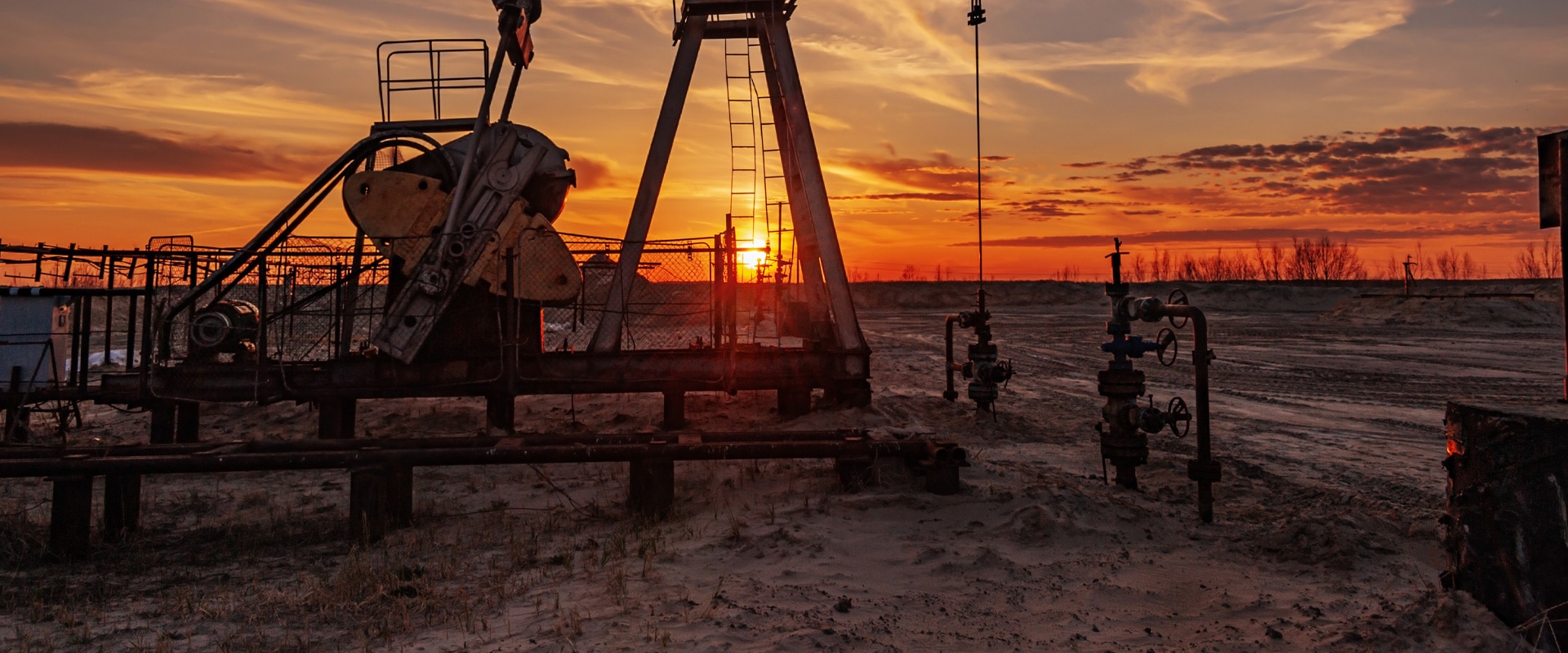 oil well at sunset